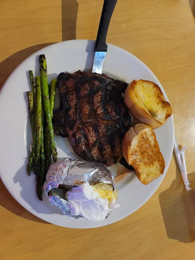 Rib Eye Steak with Baked Potatoe and Grilled Asparagus